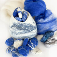 felting kits for beginners felted pod and felted pebbles, with blue and white merino felting wool roving wool top