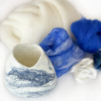 felting kit for beginners, felted pod in blue and white merino felting wool roving wool tops.