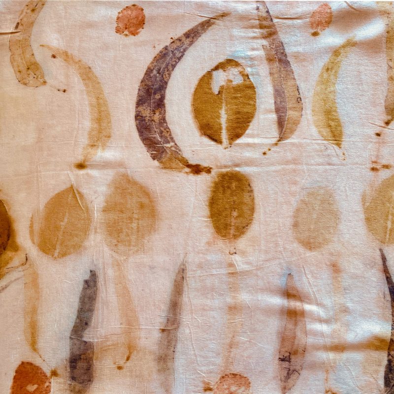 natural dyeing and eco leaf printed silk satin over natural dyed with avocado in natural dyeing workshop.